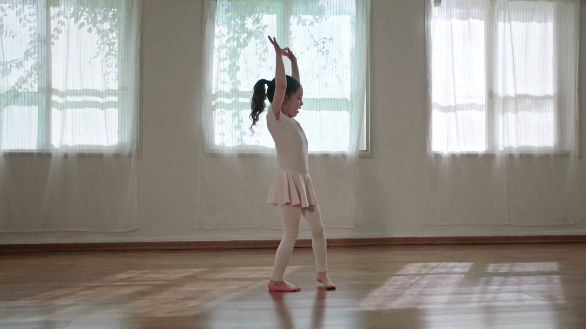 A young ballerina practicing in the window light — from the Family.Vote film